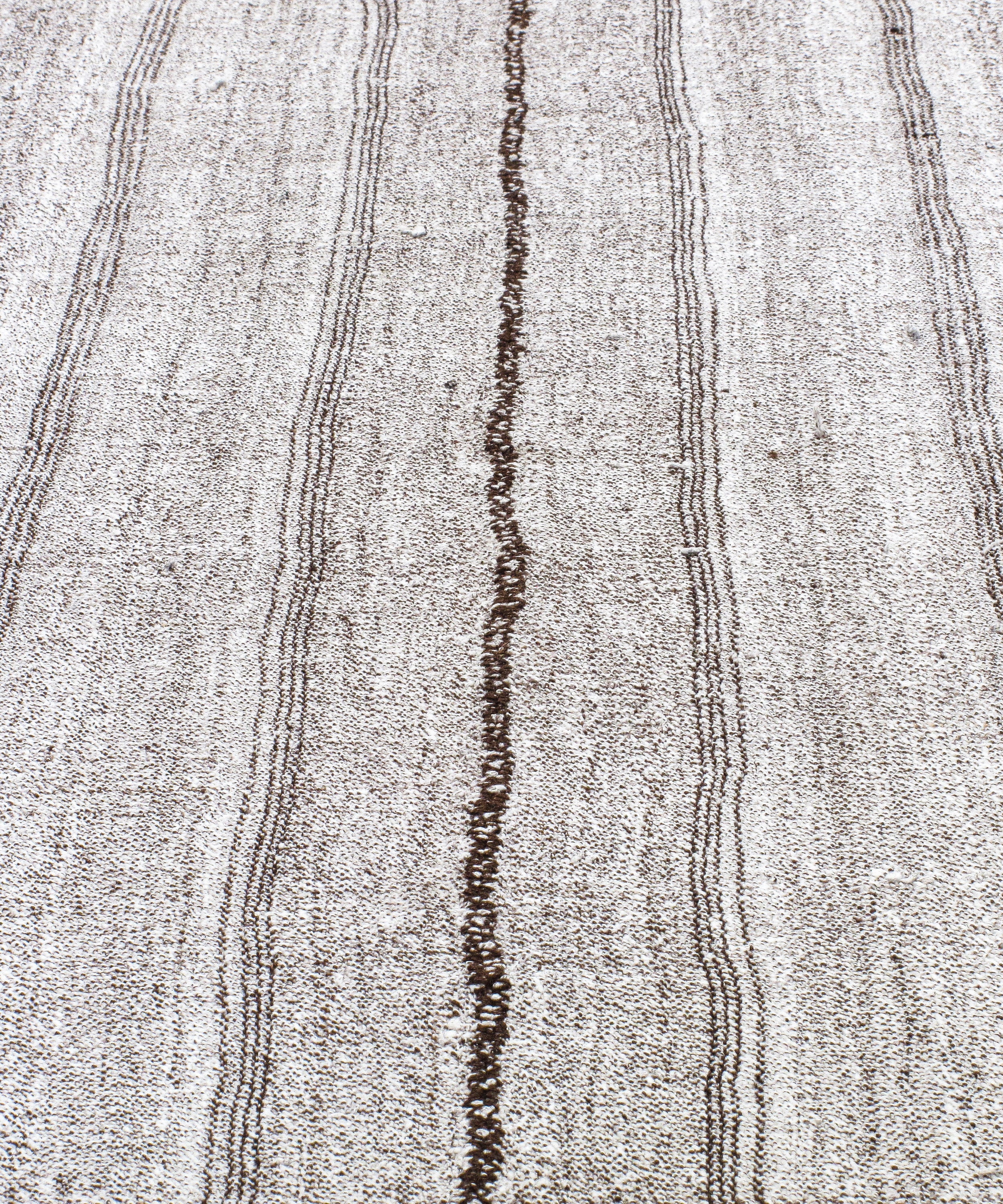 Gray Flatweave Rug with Subtle Brown Vertical Stitch Lines