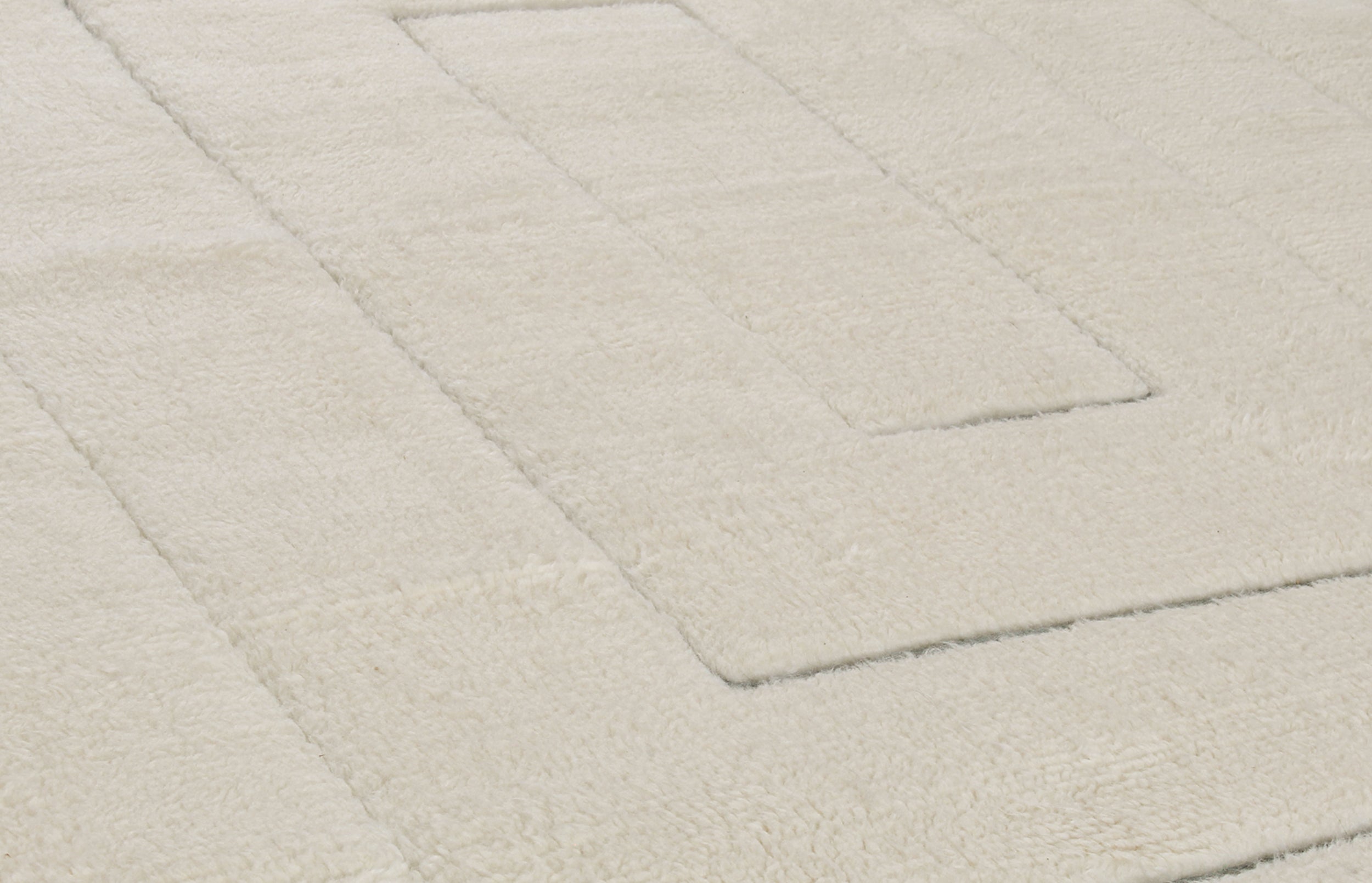 Ivory Minimalist Wool Rug with Sculpted Geometric Framing