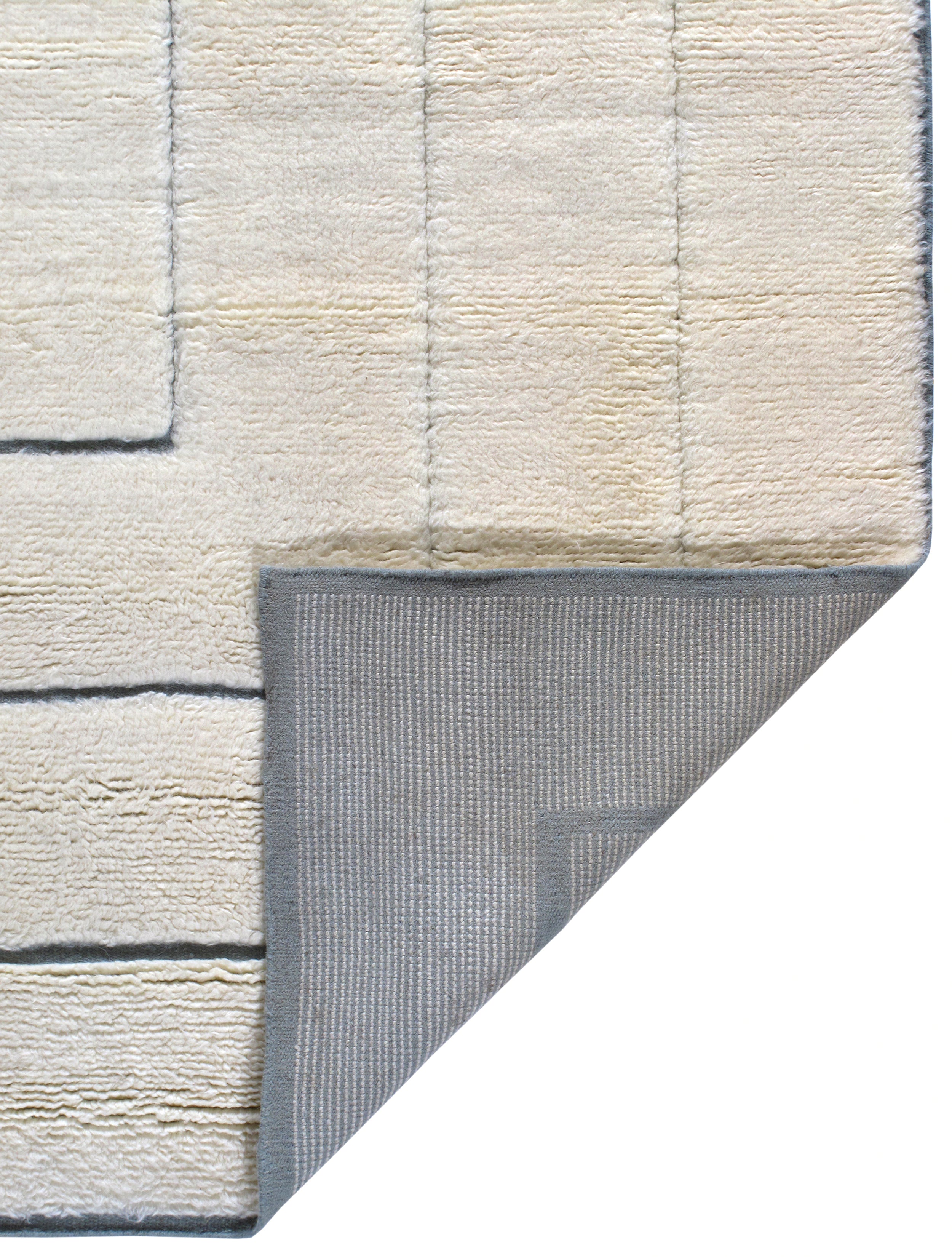 Ivory Minimalist Wool Rug with Sculpted Geometric Framing