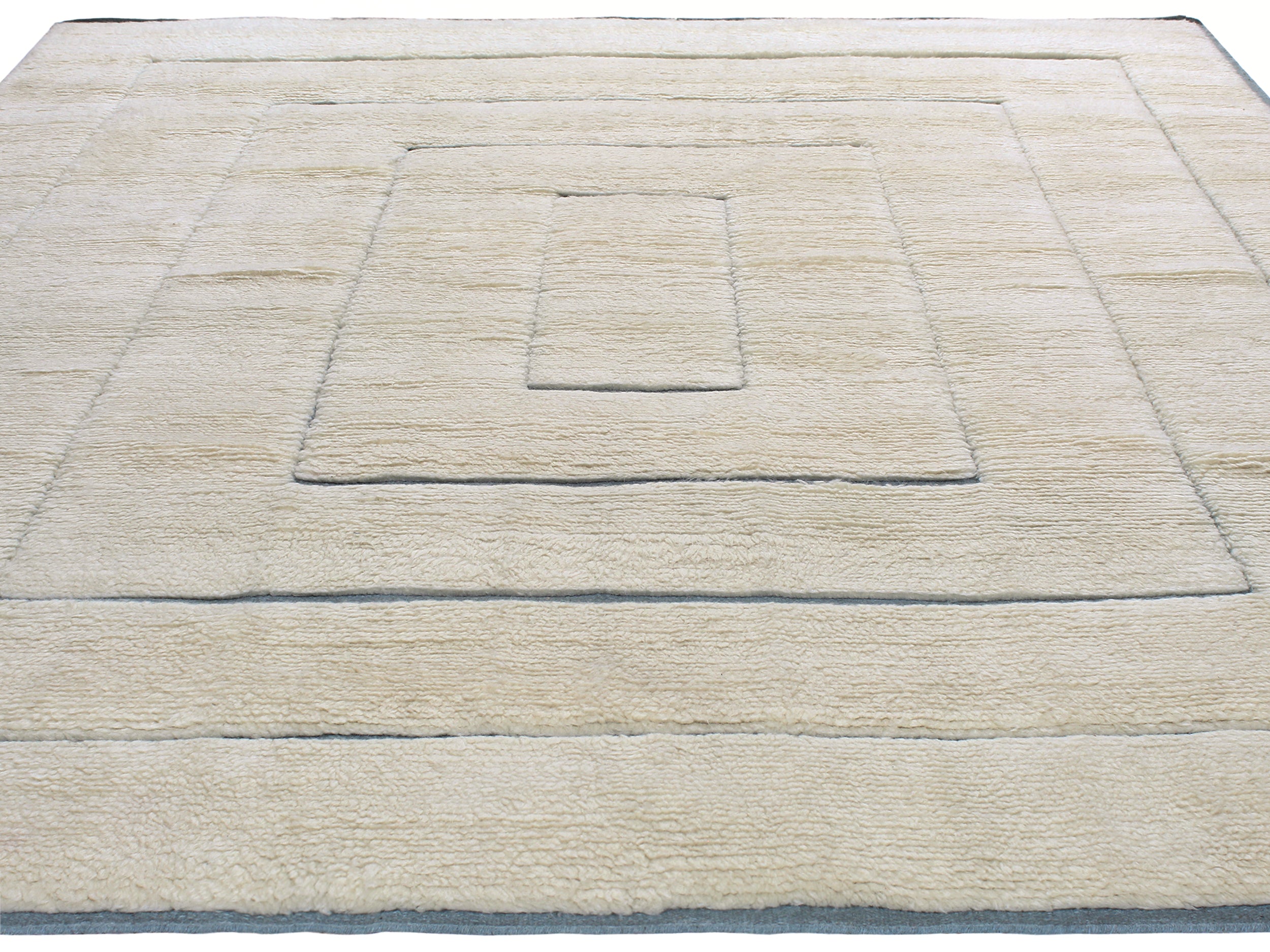 Ivory Minimalist Wool Rug with Sculpted Geometric Framing