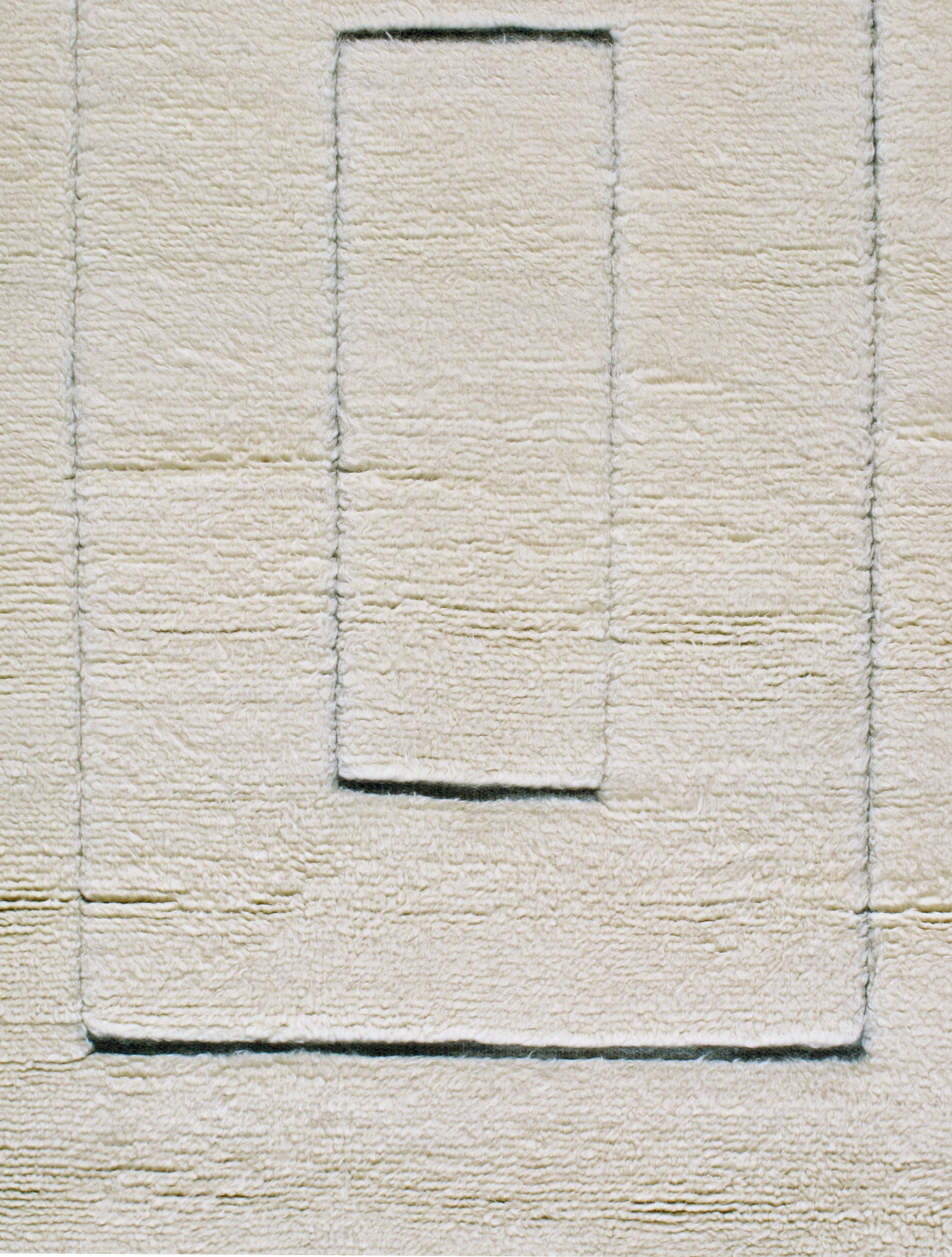Ivory Minimalist Wool Rug with Sculpted Geometric Framing