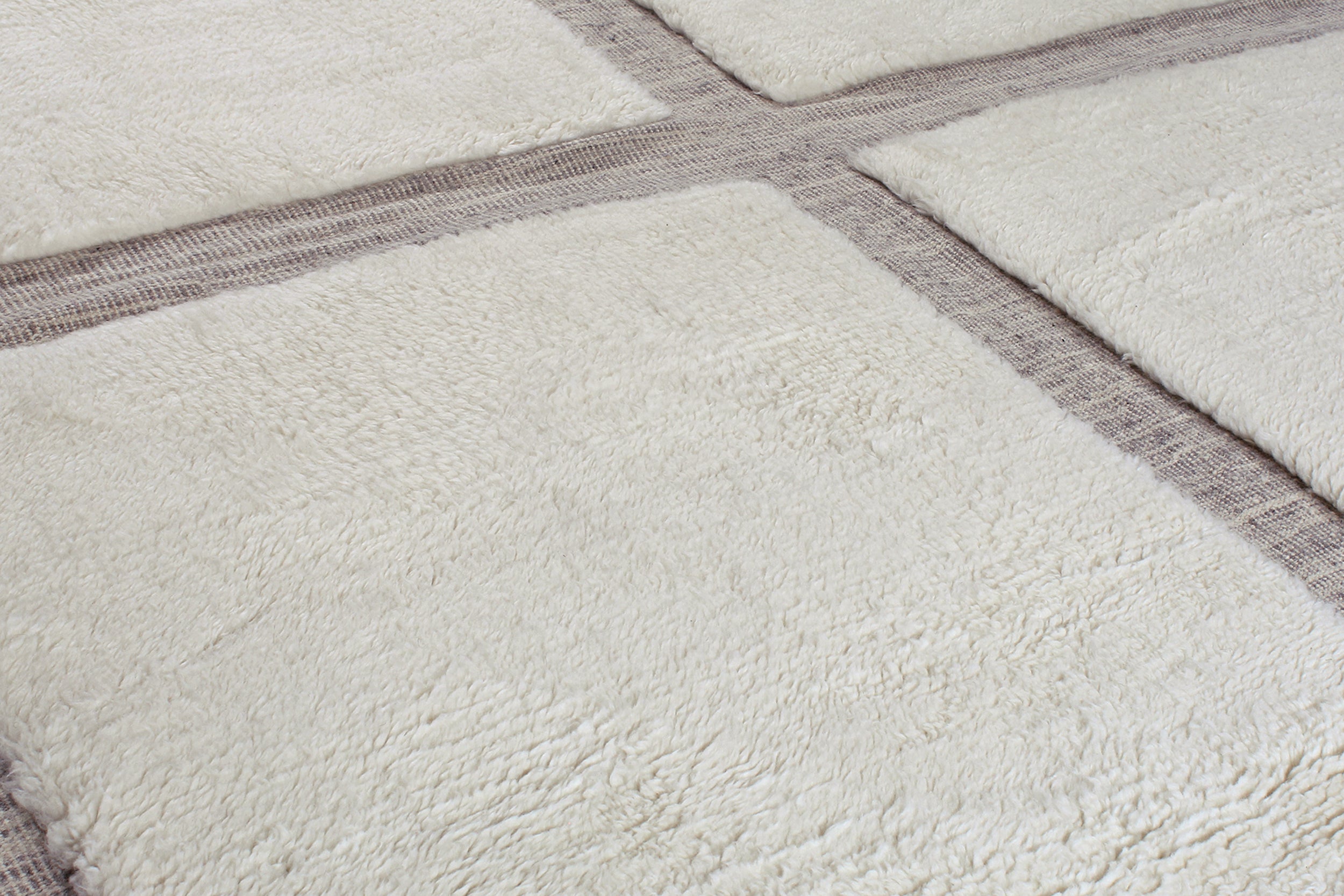 Textured Grid Wool Rug in Ivory and Taupe with Fringe Detail