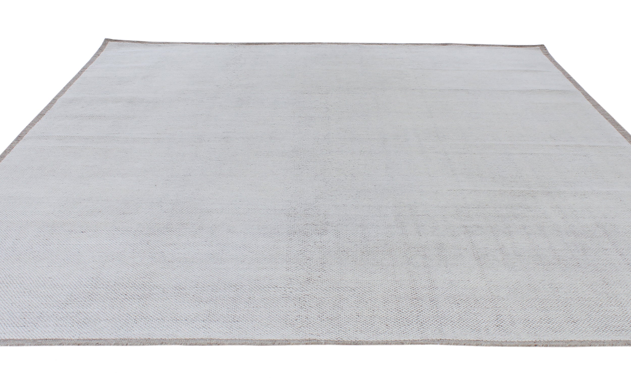Handwoven Textured Rug in Soft Ivory and Clay Border
