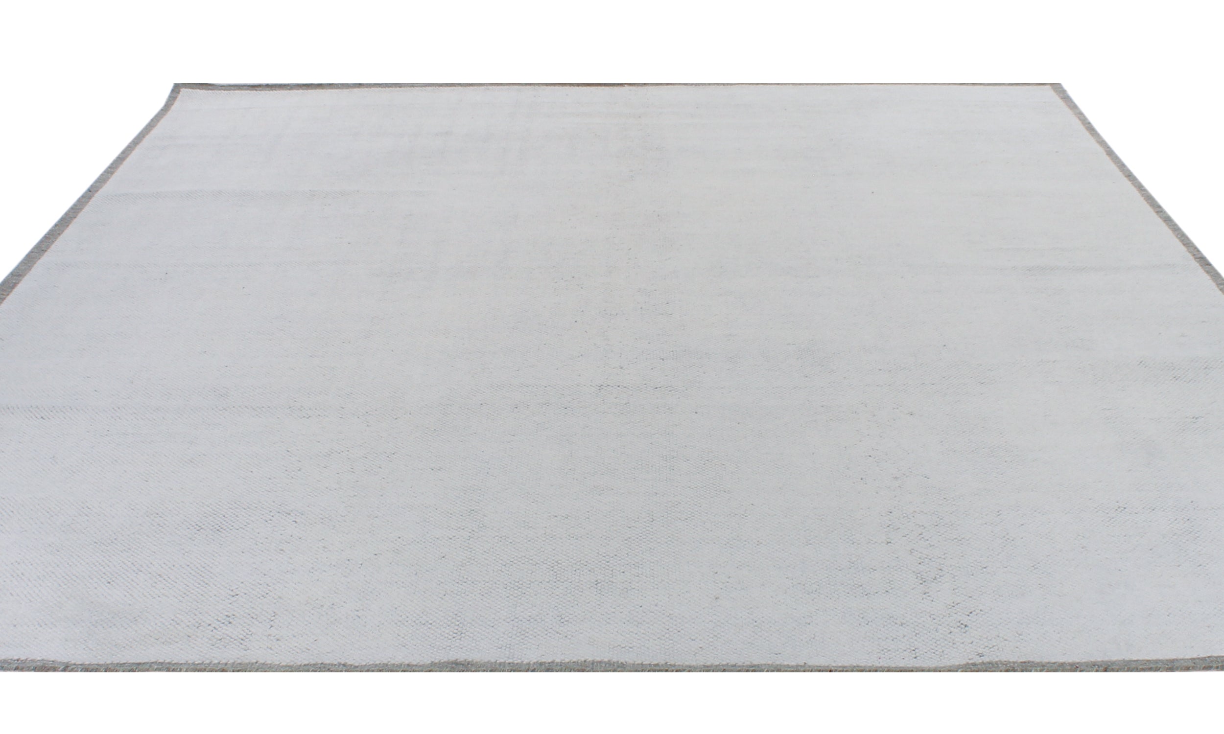 Handwoven Textured Rug in Soft Ivory and Clay Border