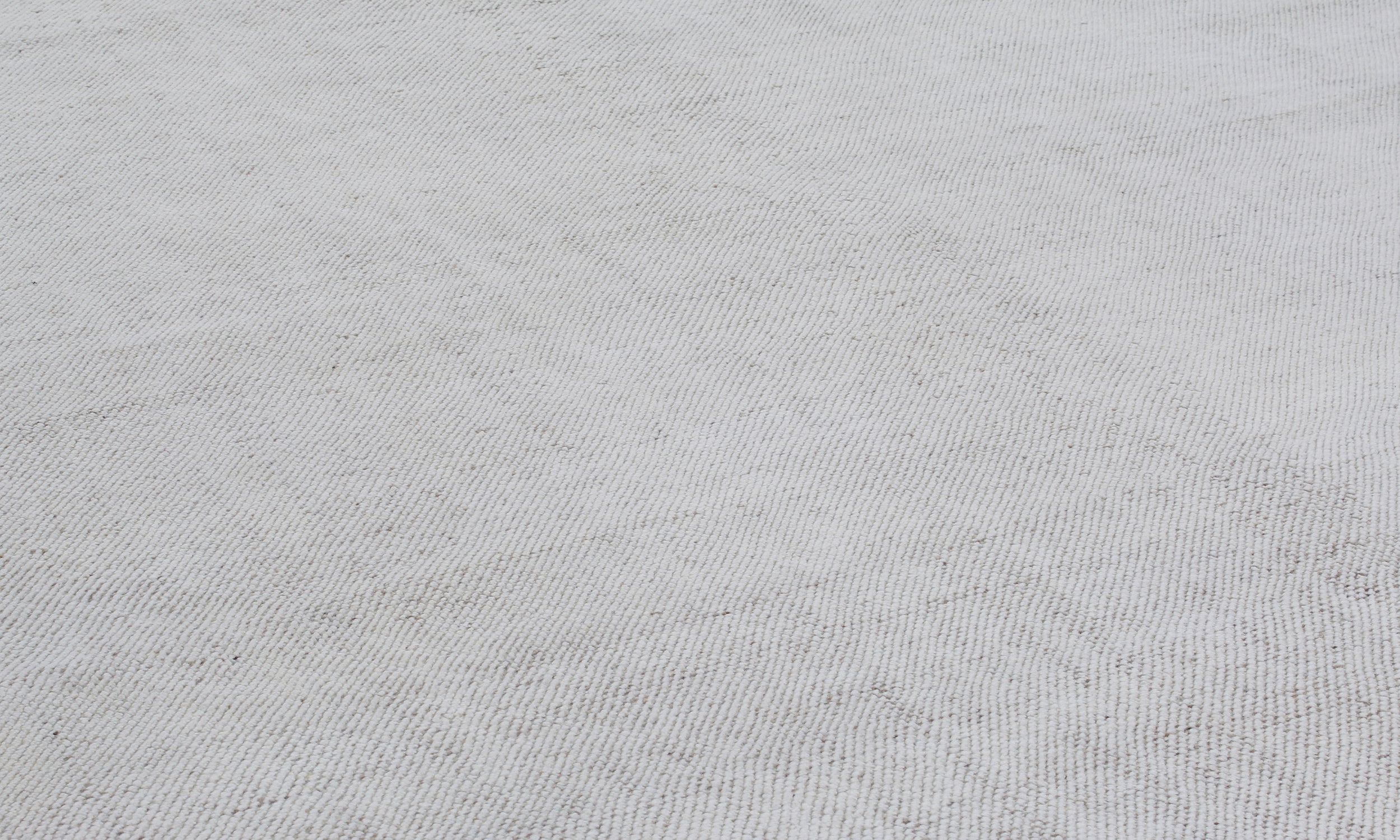 Handwoven Textured Rug in Soft Ivory and Clay Border