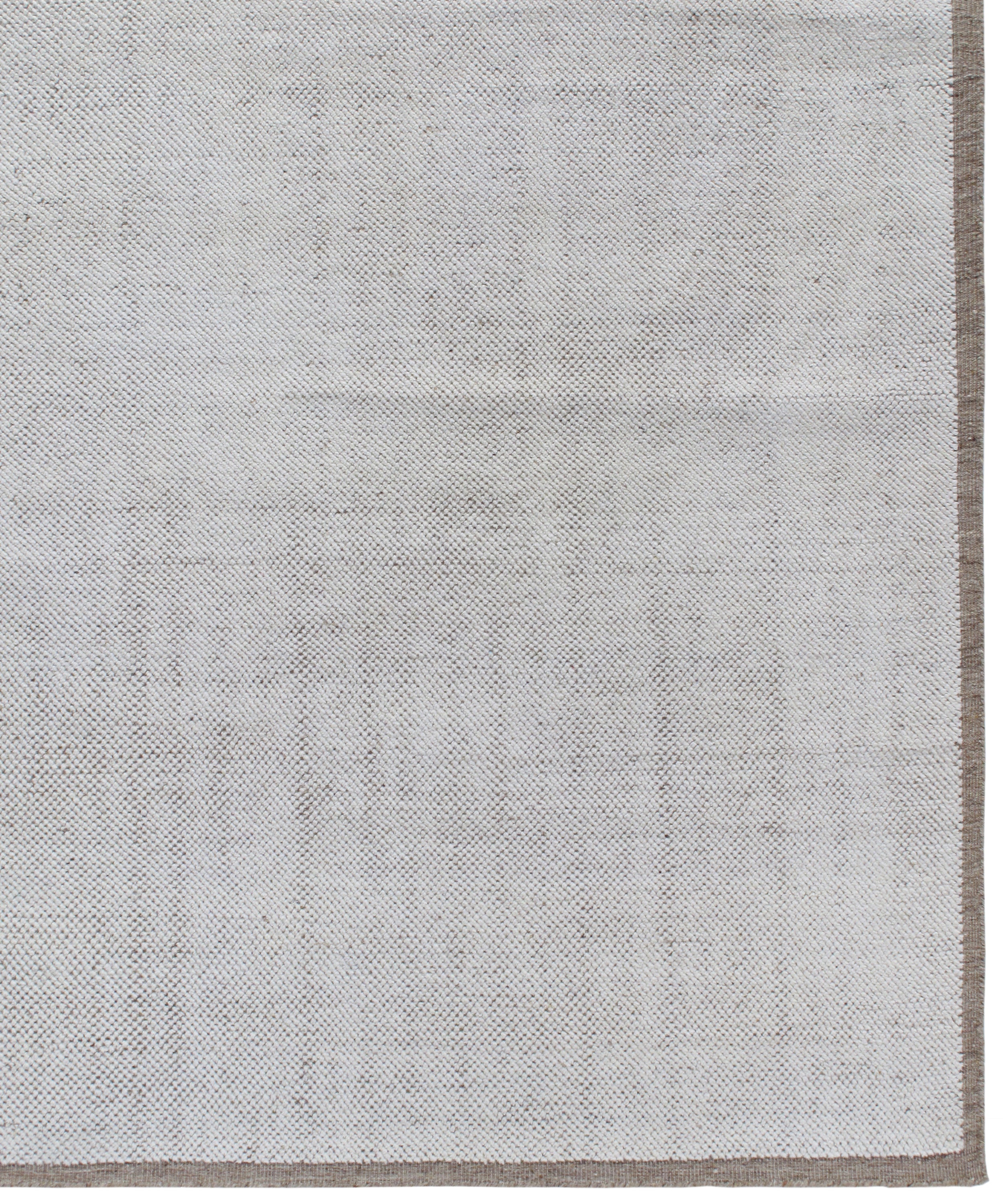 Handwoven Textured Rug in Soft Ivory and Clay Border